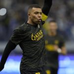 Bruised Ronaldo scores twice to edge showdown with Messi