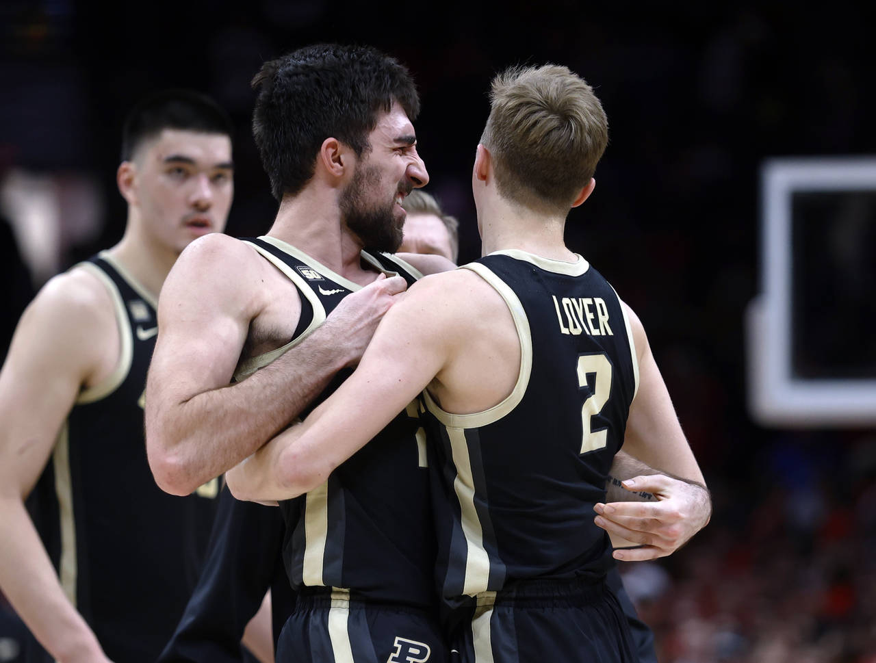 Purdue guard Ethan Morton, front left, celebrates with guard Fletcher Loyer following the team's wi...