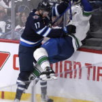 Connor's hat trick powers Jets' 7-4 win over Canucks