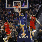 Curry's 35 points send Warriors past Raptors, 129-117