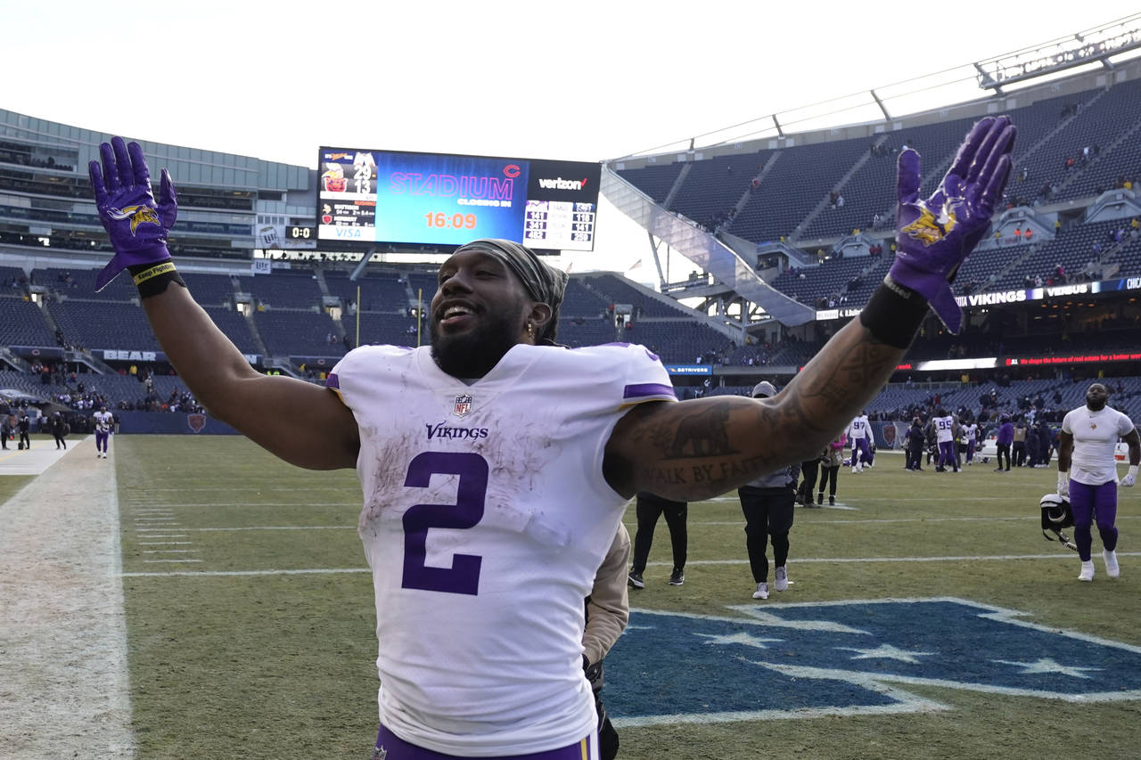 Minnesota Vikings running back Alexander Mattison celebrates after an NFL football game against the...