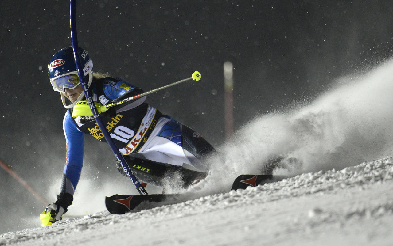 FILE - Mikaela Shiffrin, of the United States, speeds past a pole on her way to clock the second fa...