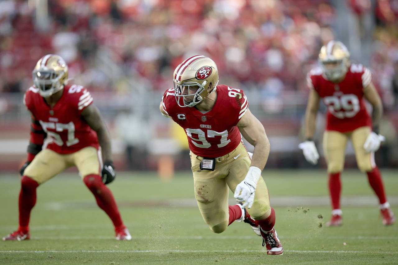 FILE- San Francisco 49ers defensive end Nick Bosa (97) rushes during an NFL football game against t...