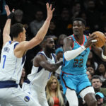 Dinwiddie scores 36, Mavs top Suns 99-95 after Doncic hurt