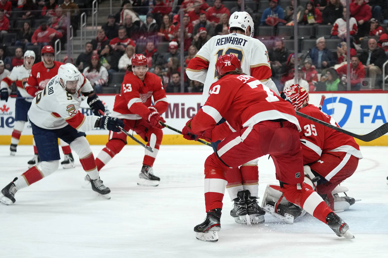 Florida Panthers defenseman Aaron Ekblad (5) scores on Detroit Red Wings goaltender Ville Husso (35...