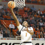 Carr, tough defense lead No. 6 Texas past Oklahoma St. 56-46
