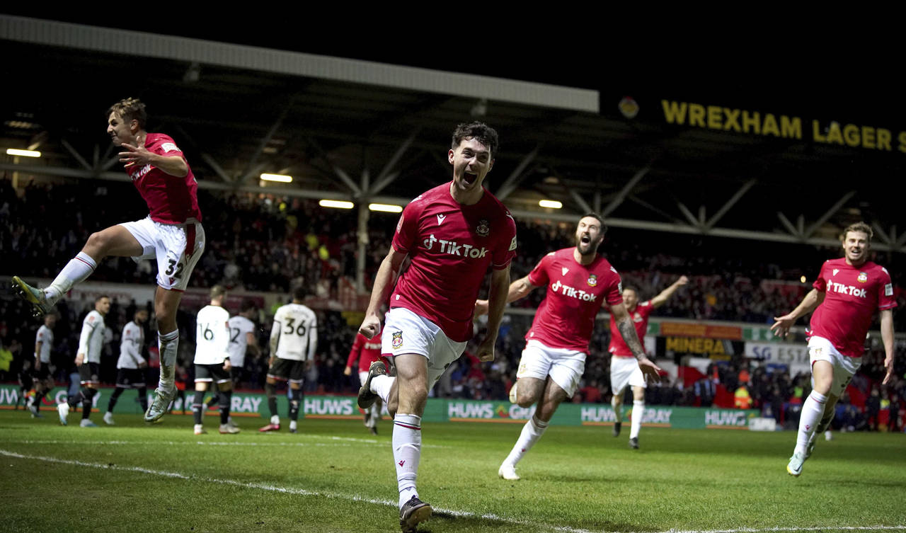 Wrexham's Tom O'Connor celebrates scoring against Sheffield United during the English FA Cup fourth...
