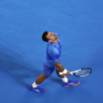 Djokovic bothered by leg, heckler during Australian Open win