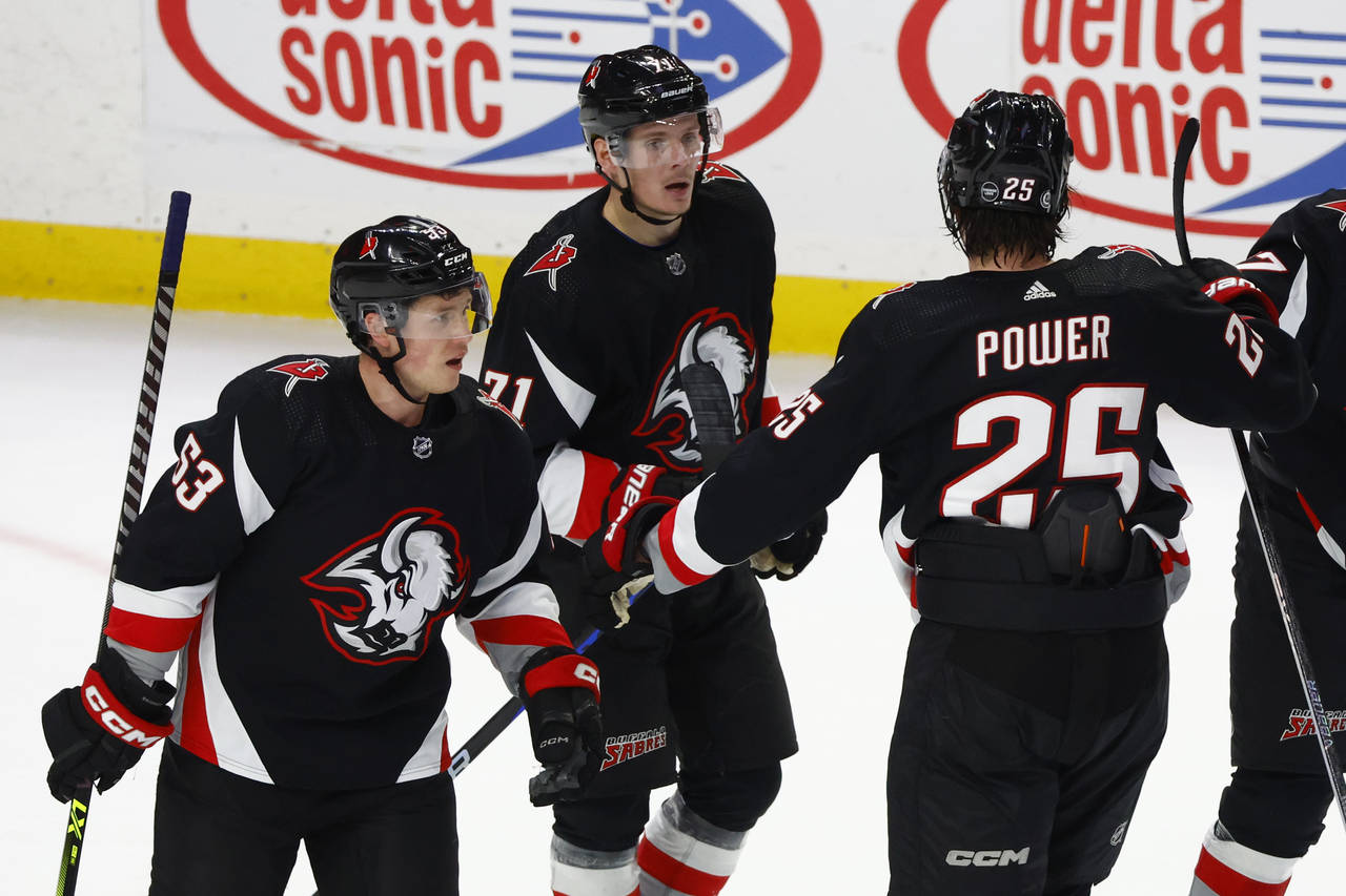 Buffalo Sabres left wing Victor Olofsson (71) celebrates after his winning goal with left winger Je...