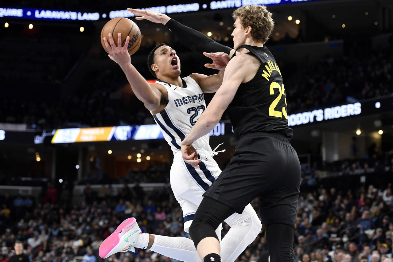 Memphis Grizzlies guard Desmond Bane shoots against Utah Jazz forward Lauri Markkanen (23) in the s...