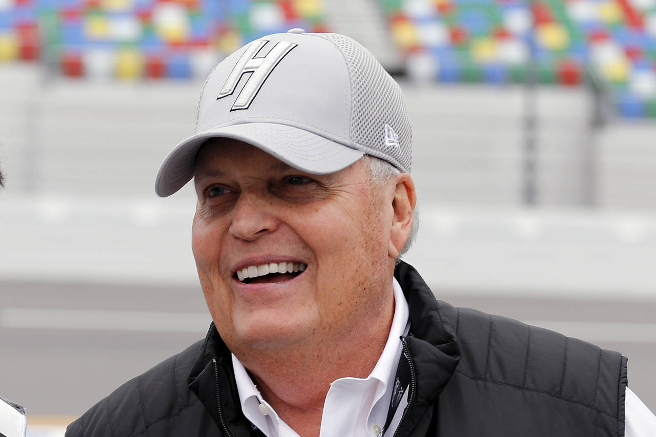 FILE - NASCAR team owner Rick Hendrick laughs on pit road during qualifying for the Daytona 500 aut...