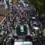 Pelé's coffin arrives at cemetery in city he made famous