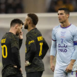 Bruised Ronaldo scores twice to edge showdown with Messi