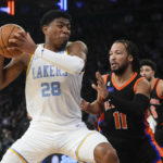 James has triple-double, leads Lakers past Knicks in OT