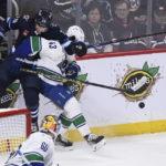 Connor's hat trick powers Jets' 7-4 win over Canucks