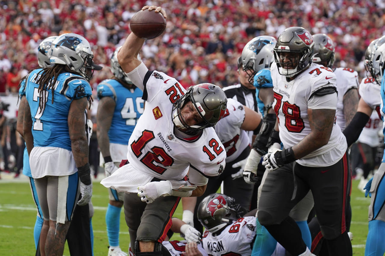 Tampa Bay Buccaneers quarterback Tom Brady celebrates after scoring during the second half of an NF...