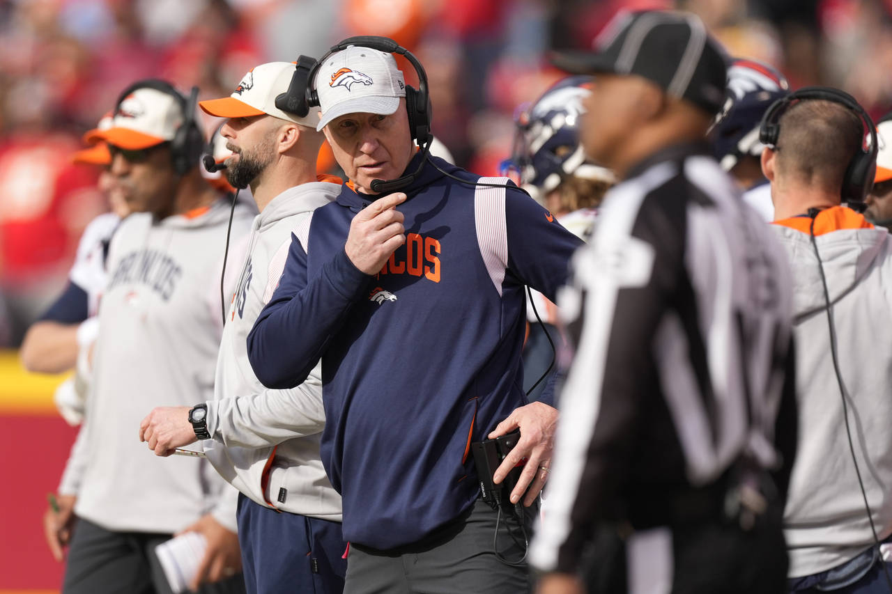 Denver Broncos interim head coach Jerry Rosburg watches from the sidelines during the first half of...