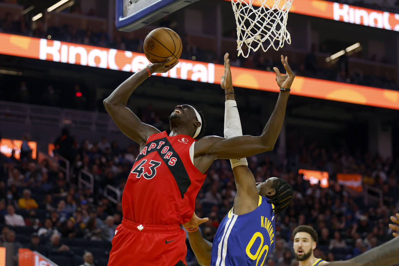 Toronto Raptors forward Pascal Siakam (43) shoots against Golden State Warriors forward Jonathan Ku...