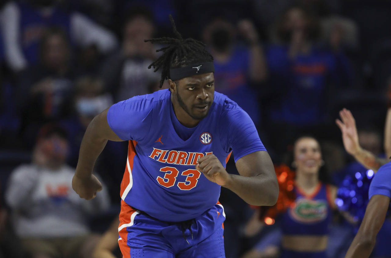 Florida center Jason Jitoboh (33) runs up court after making a shot against Alabama during the firs...