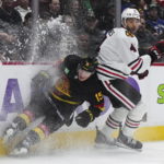 Canucks beat Blackhawks 5-2 in Tocchet's debut as coach