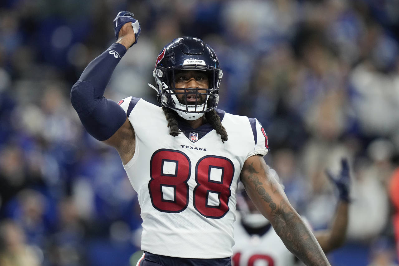 Houston Texans tight end Jordan Akins reacts after scoring on a 28-yard touchdown pass during the s...