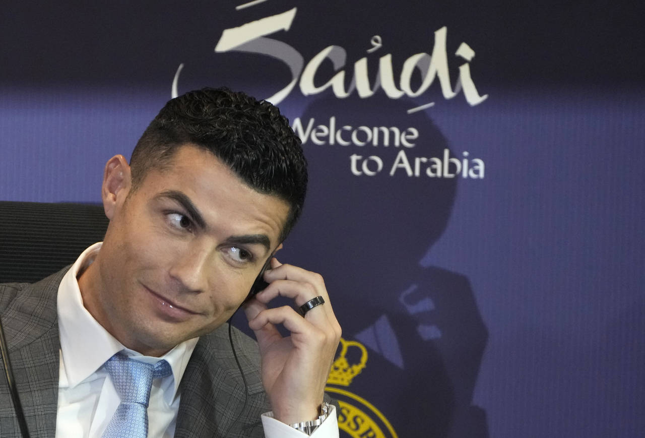 Cristiano Ronaldo speaks during a press conference for his official unveiling as a new member of Al...