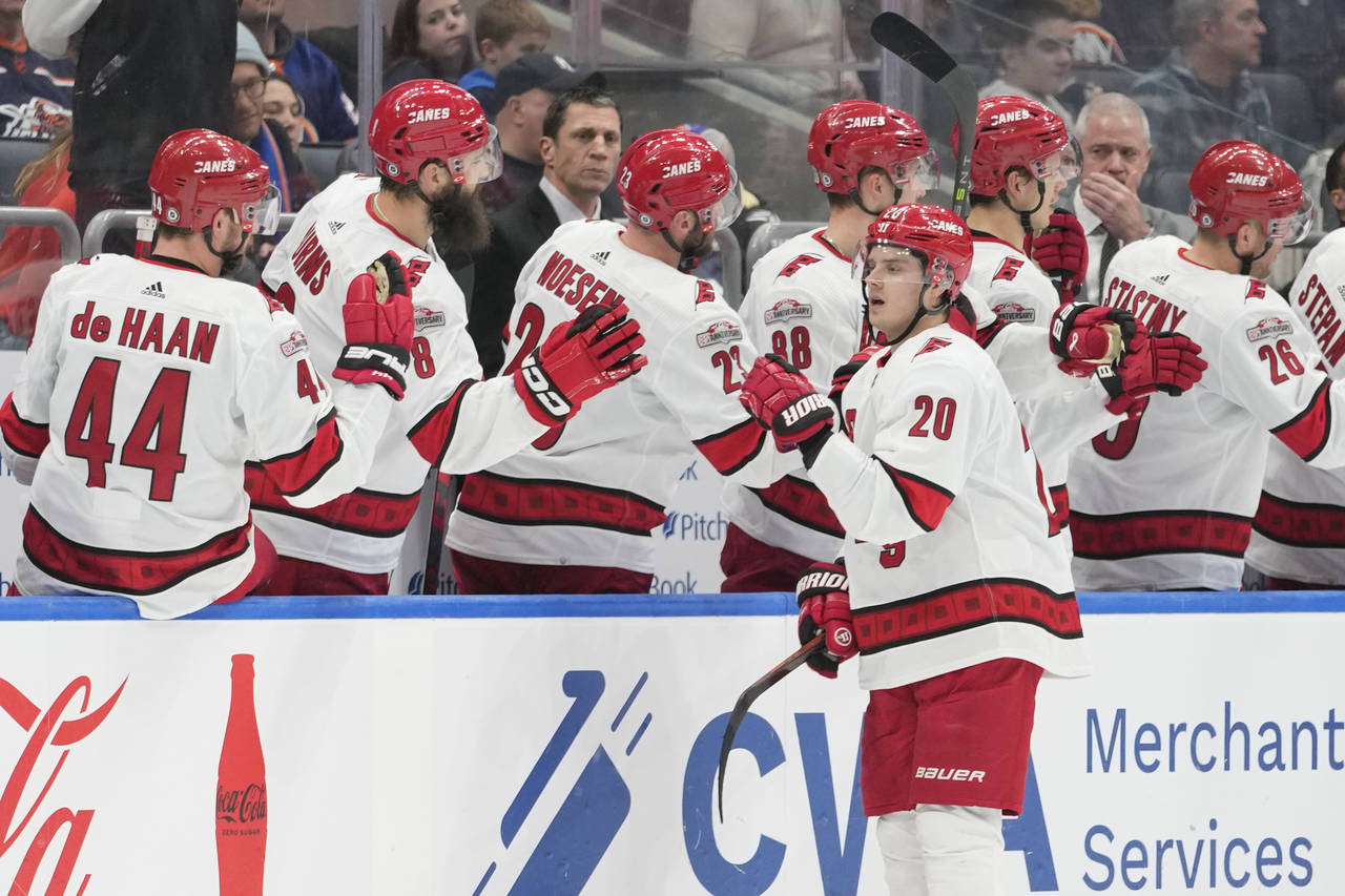 Carolina Hurricanes center Sebastian Aho (20) celebrates after scoring against the New York Islande...