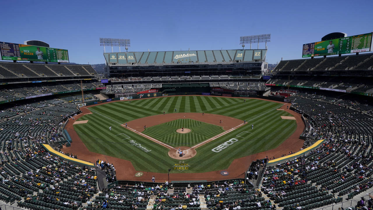 FILE - Fans at RingCentral Coliseum watch a baseball game between the Oakland Athletics and the Hou...