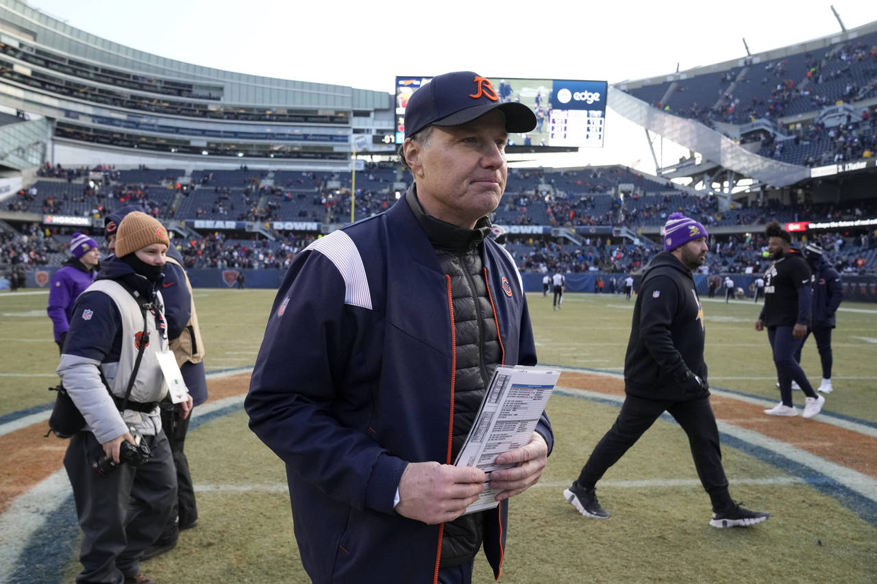 Chicago Bears head coach Matt Eberflus walks off the field after an NFL football game against the M...