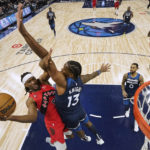 Russell scores 16 points in 4th, Wolves beat Raptors 128-126