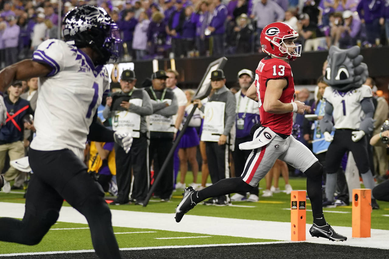 Georgia quarterback Stetson Bennett (13) runs into the end zone for a touchdown against TCU during ...