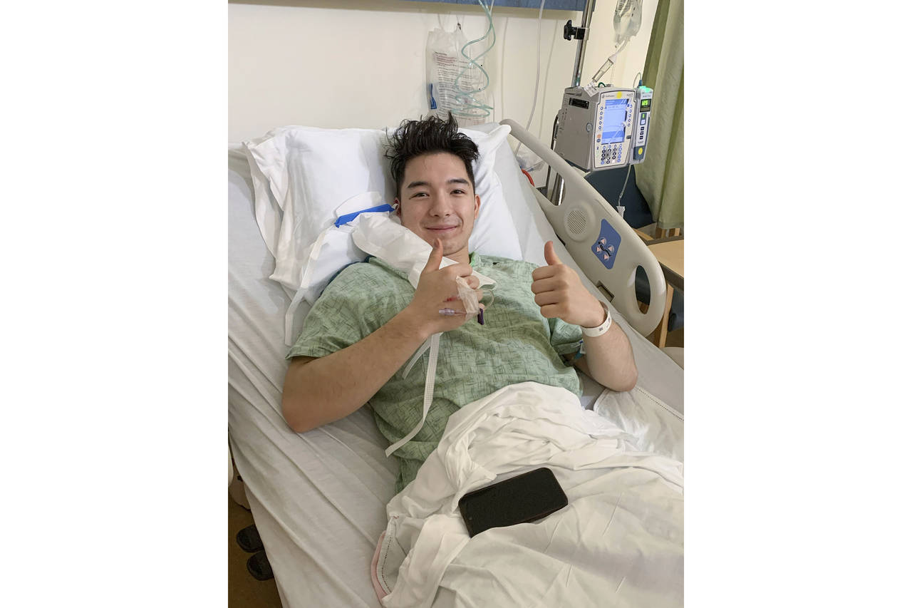 This photo provided by Army West Point shows Army hockey player Eric Huss recovering at at St. Vinc...