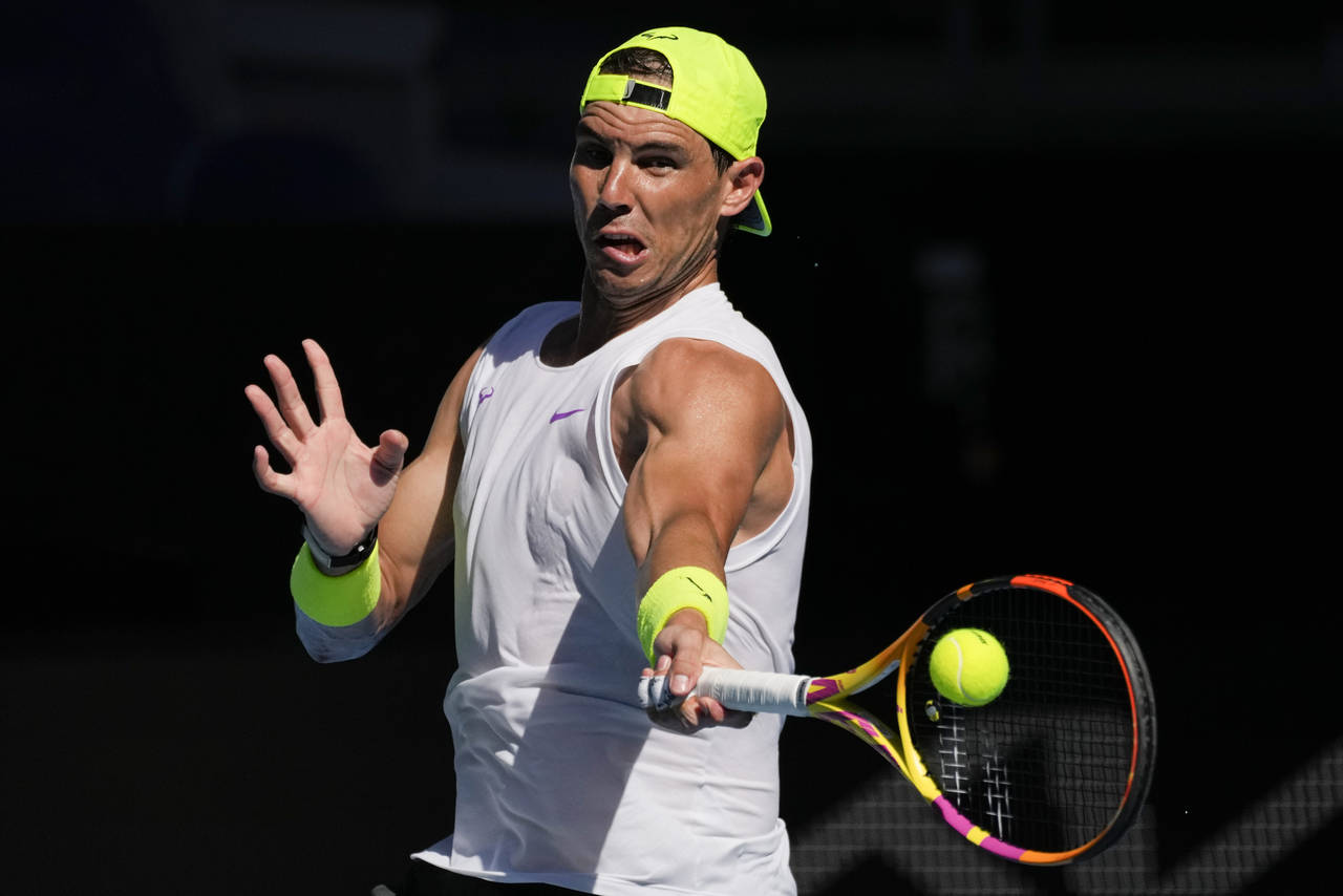 Spain's Rafael Nadal plays a forehand return to during a practice session ahead of the Australian O...