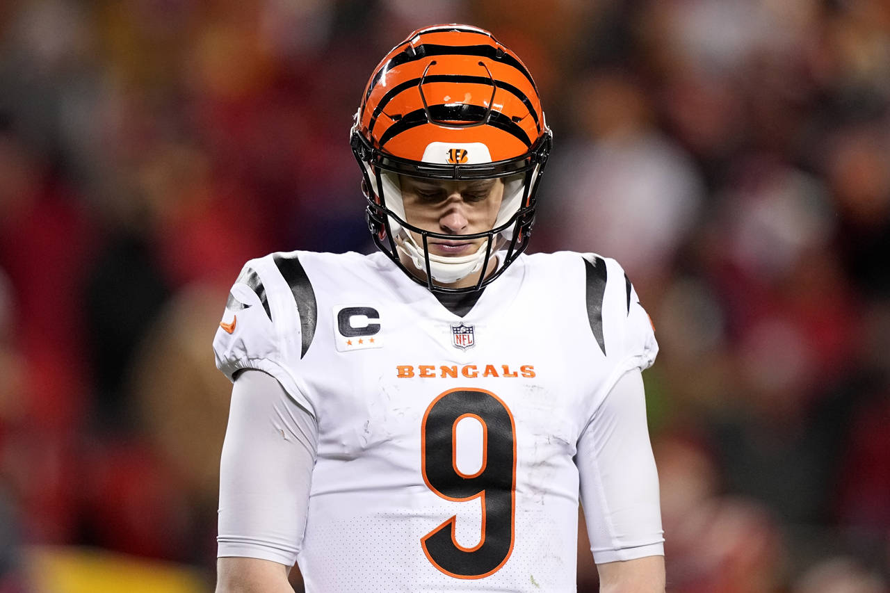 Cincinnati Bengals quarterback Joe Burrow (9) walks back to the sidelines during the second half of...