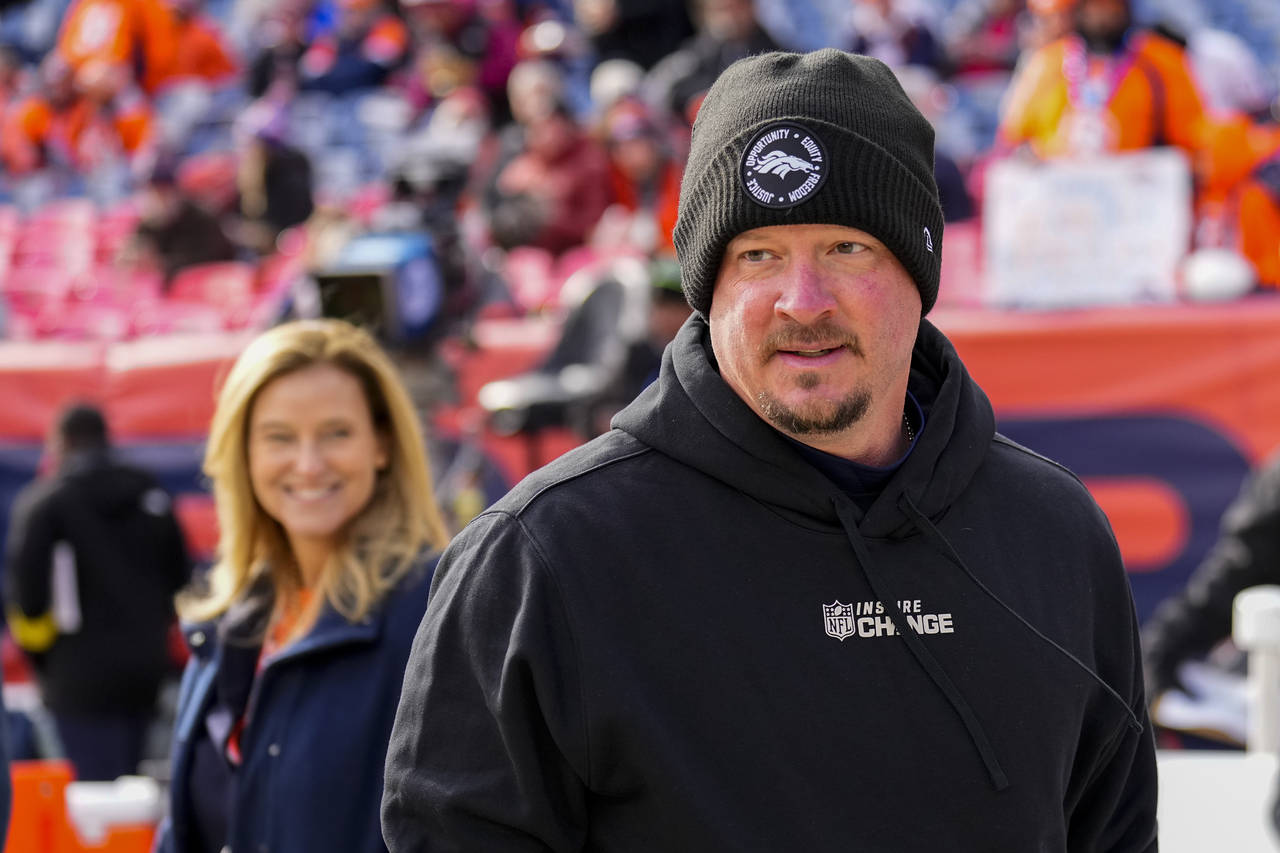 FILE - Denver Broncos head coach Nathaniel Hackett looks on before an NFL football game against the...