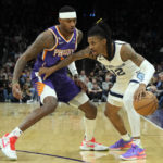 Paul returns, Suns hold on for 112-110 win over Grizzlies
