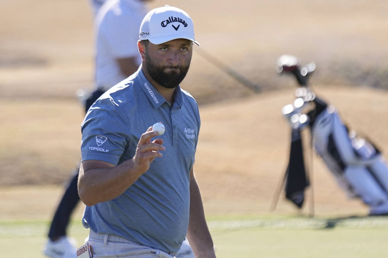 Jon Rahm acknowledges the gallery as he walks off the third green during the American Express golf ...