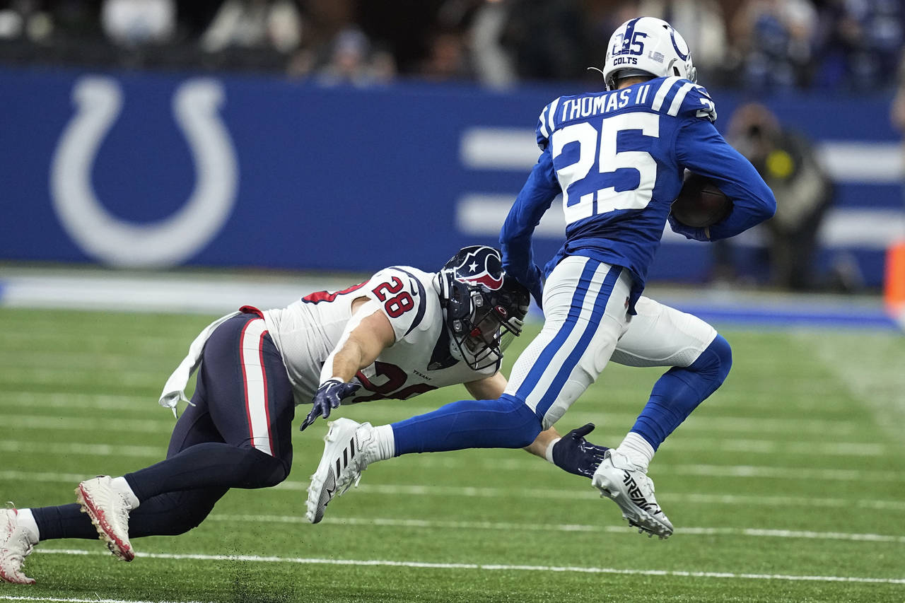 Indianapolis Colts safety Rodney Thomas II (25) tries to get past Houston Texans running back Rex B...