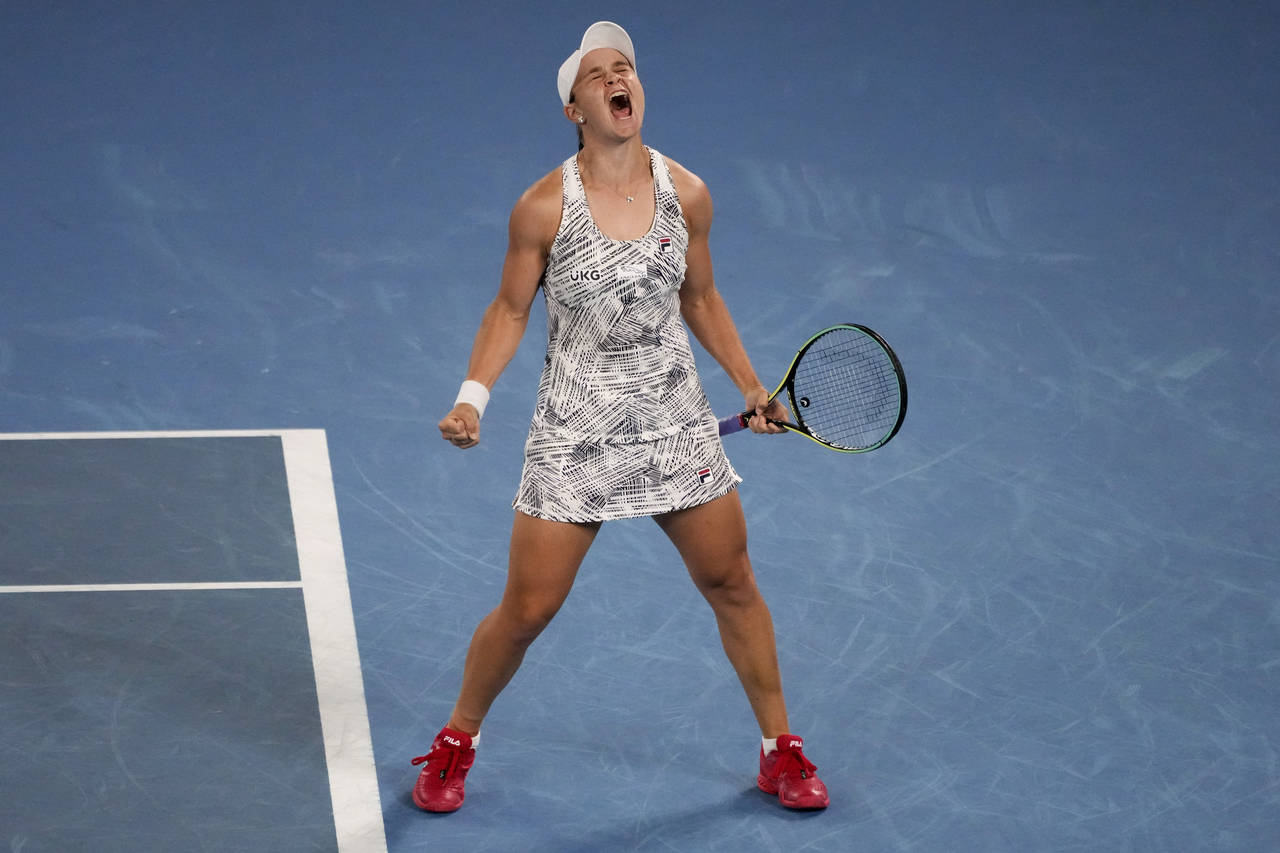 FILE - Ash Barty of Australia celebrates after defeating Danielle Collins of the U.S., in the women...