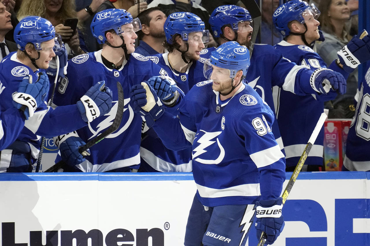 Tampa Bay Lightning center Steven Stamkos (91) celebrates with the bench after his goal against the...