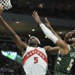 Holiday scores season-high 37, Bucks beat Raptors 130-122