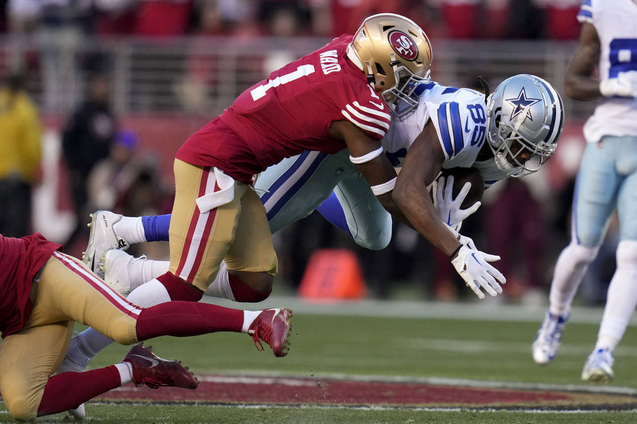 San Francisco 49ers cornerback Jimmie Ward (1) tackles Dallas Cowboys wide receiver Noah Brown duri...