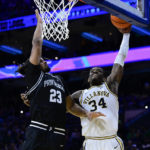 Bynum leads No. 23 Providence past Villanova 70-65