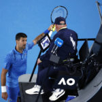 Djokovic bothered by leg, heckler during Australian Open win