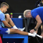 Djokovic bothered by leg, heckler during Australian Open win