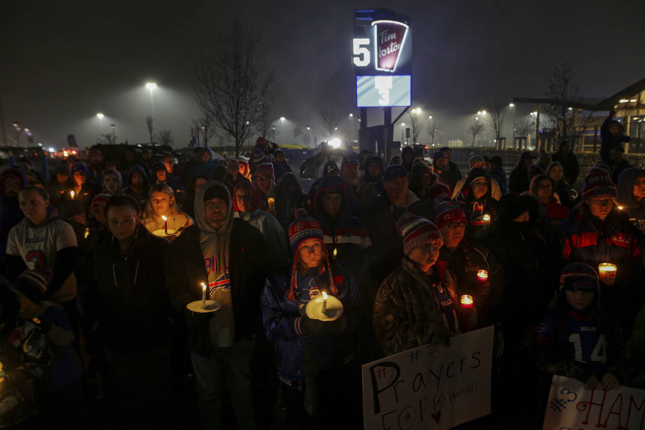 FILE - Buffalo Bills fans and community members gather for a candlelight vigil for Buffalo Bills sa...