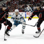 Martin Necas leads Hurricanes past Sharks 5-4 in overtime