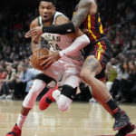 Holiday, Lopez help Bucks hold off Hawks, 114-105