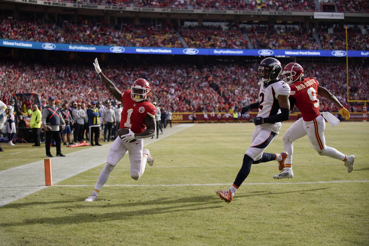 Kansas City Chiefs running back Jerick McKinnon (1) celebrates after scoring past Denver Broncos co...