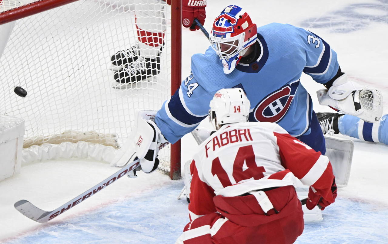 Detroit Red Wings' Robby Fabbri (14) scores against Montreal Canadiens goaltender Jake Allen (34) d...